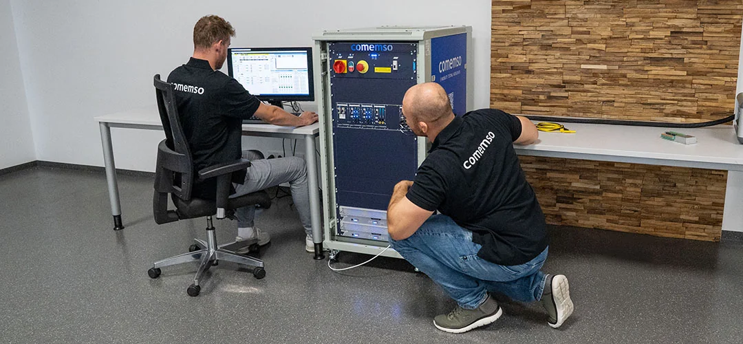 Employees working with a Battery Cell Simulator and its software