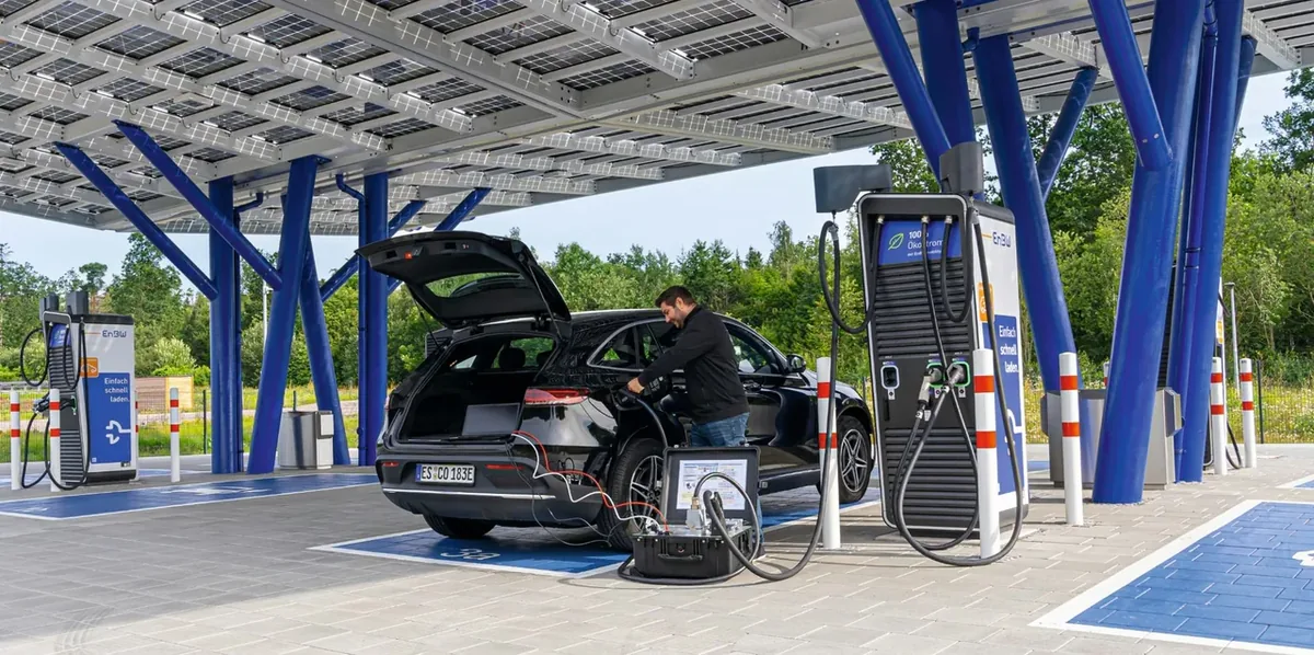 EVCA Interop connected between a real electric vehicle and a public DC charging station during an interoperability investigation